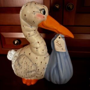 Vintage adorable large Stork with baby .